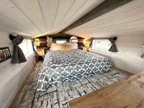Queen bed in the bedroom loft.