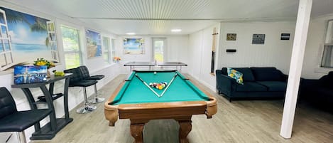 The ultimate fun GAME room!! Pool table, Ping Pong table, TV, cool AC, couches