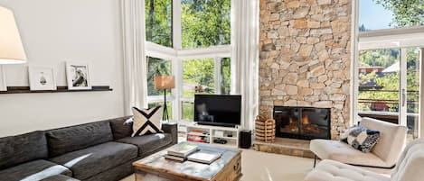 The spacious and inviting living area of this vacation rental is an ideal space to relax when visiting Aspen.