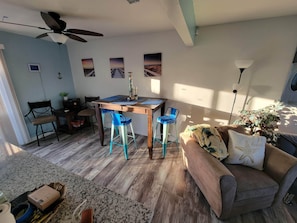 The dining room area. Office station. On very left the Kitchen island bar