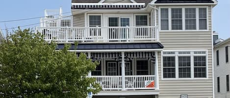 Beach block, generous front porch and awnings. 
