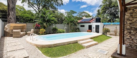 Private pool surrounded by plant life