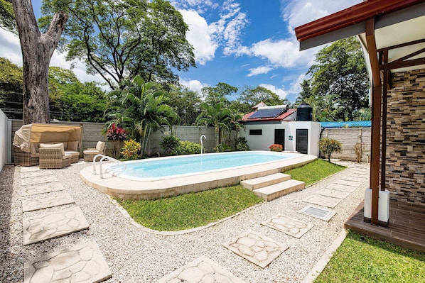 Private pool surrounded by plant life