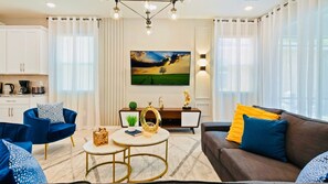 Living Room: Spacious and inviting, the area features a cozy sofa