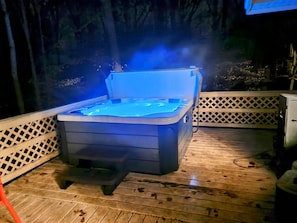 This tub has color changing LED lighting , Bluetooth radio,  1 lay down, seats 5