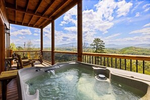 Soak away worries in the hot tub while gazing at these mountain views!