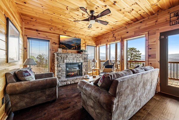 Cozy up in the living room next to the fireplace and enjoy Amazing Mountain View