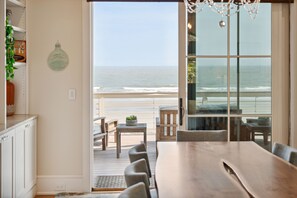 A custom dining table with seating for 8 and a stunning ocean view.