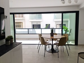 Dining table between living room and terrace