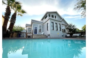 Looking from behind the pool at Woodlawn Manor, upgraded 1915 Craftsman.