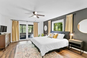 Primary Bedroom with on suite bathroom and screened porch.