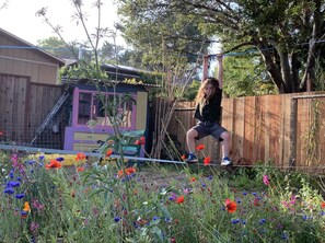 Playing on the Zip Line in the backyard is awesome for kids to enjoy