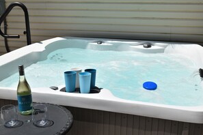 Unwind after a day at the beach in the new 6 person hot tub!