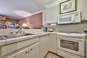 The fully-equipped kitchen features all the amenities you'd need to make a delicious meal.
