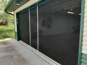 The garage now has a giant screen door.  Keep the bugs out and enjoy the nights!