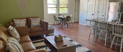 Living room is open to the kitchen and dining area. 