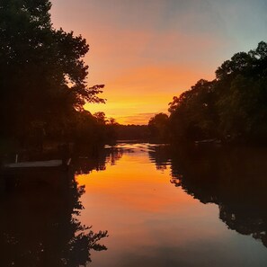 Enjoy beautiful sunsets while relaxing by the water.