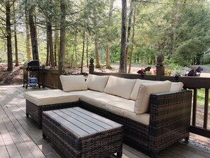 Soak up the sun on our outdoor deck with a comfy couch and BBQ grill.