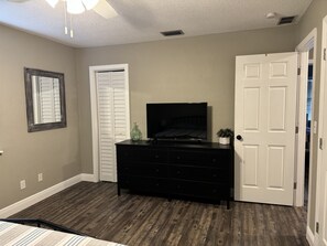 Master Bedroom - dresser, closet, TV (YouTube TV provided)