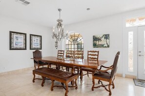 Spacious Dining Area for 16,  table seats 10.  Bar Seats 4.