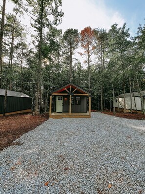 Parking beside cabin for trailer with plenty of room for your vehicle too