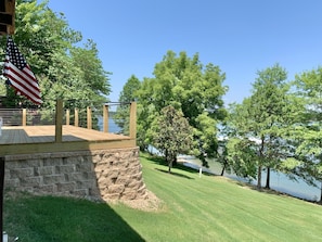 Backyard view of lake and deck.