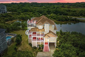 Serenity sounds this home from its perch on a private lake in Avon.