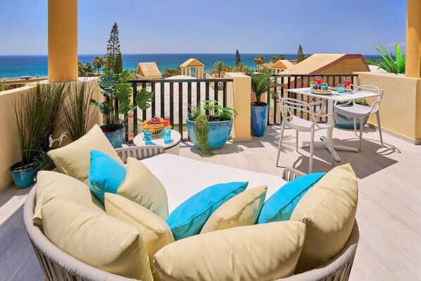 Sun all day and panoramic sea views, on the outdoor terrace lounge.