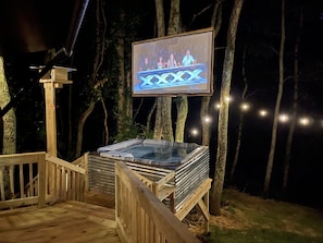 Enjoy outdoor theatre under the stars while relaxing in the hot tub.