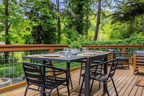 Dine al fresco on the private deck — perfect for morning coffee or sunset dinners.