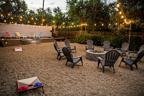 Cornhole, firepit, stock tank pool, market lights.