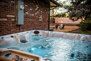Luxury hot tub overlooking the rest of the backyard.