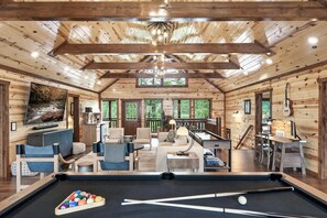 Massive game room with 86" TV, pool table, shuffle board, video games and more