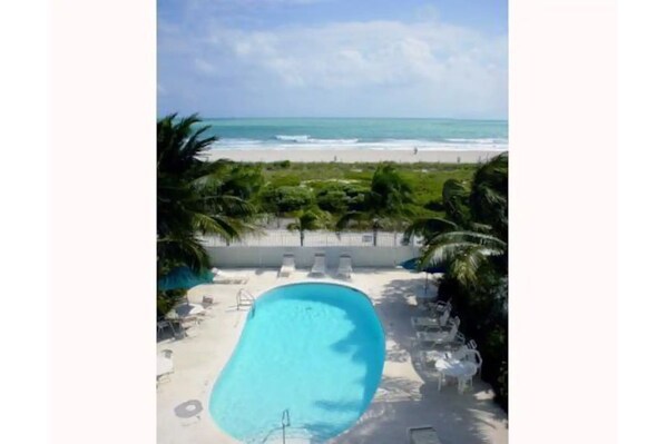 Pool and beach behind the building