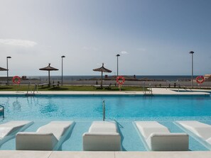 Water, Sky, Property, Swimming Pool, Azure, Cloud, Outdoor Furniture, Shade, Chair, Sunlounger