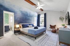 You'll be right at home in this master bedroom with a king bed, wireless chargers, full length mirror and a walk in closet. You'll love the hand painted wall which adds a cozy ambiance. Large TV has Hulu, Netflix and Amazon prime for your sign in.