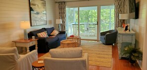 Access to screened porch with sitting area and outdoor dining.