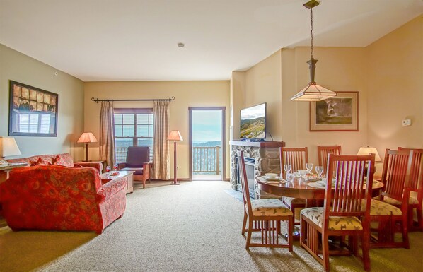 Living room with gas fireplace, and queen sleeper sofa