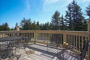 Furnished deck with 6 chairs and table