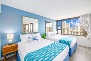 Bedroom with two Queen-size beds. Closet and access to the bathroom