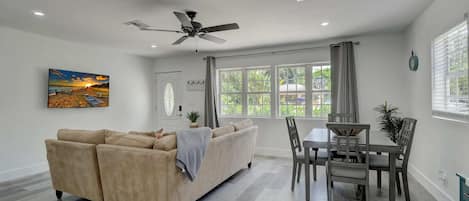 Looking Towards the Front Door and Sofa and Dining Set From the Kitchen