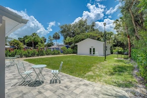 The Studio Has a Patio with a Set of Chairs and a Table Just Outside