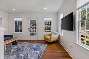 Living Room with access to our front porch swing