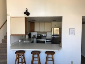 Kitchen with bar for eating and seating