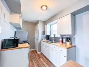 A stylish kitchen adorned with sleek appliances and ample countertop space.