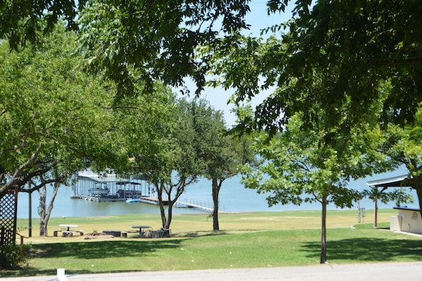 View from the porch. The Lake is across the street. Vacant Lot gives waterfront.