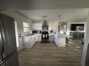 Kitchen/bar area that views the lake through the living room window.