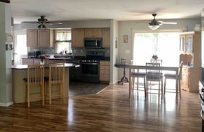 Full kitchen with all the appliances you can think of. Kitchen island and Table.