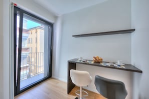 Table in kitchen for wonderful breakfasts with small balcony
