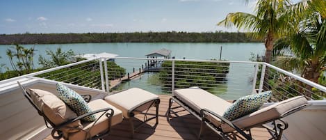 View from master bedroom balcony overlooking boat dock and the Roosevelt Channel